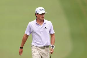 Aug 2, 2025; Greensboro, North Carolina, USA; Jackson Koivun walks onto the 18th green during the third round of the Wyndham Championship golf tournament. Mandatory Credit: Allison Lawhon-Imagn Images