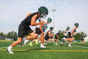 High school football practice kicks off