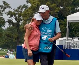 Stacy Lewis gets a hug from her father, Dale, as she wraps up her stellar LPGA career at the Chevron Championship.