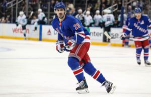 Dec 8, 2024; New York, New York, USA; New York Rangers left wing Chris Kreider (20) skates against the Seattle Kraken during the third period at Madison Square Garden.