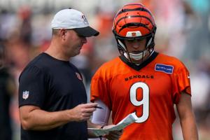 Cincinnati Bengals head coach Zac Taylor talks with quarterback Joe Burrow (9) during the first day of Cincinnati Bengals