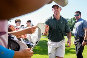 Rory McIlroy signs items for spectators after finishing his round of golf at the eighteenth hole during the FedEx St. Jude Championship Pro-Am at TPC Southwind in Memphis, Tenn., on August 12, 2026.