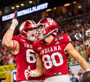 Indiana's Charlie Becker (80) celebrates with Carter Smith (65) on a touchdown that was ruled down before the endzone during the College Football Playoff National Championship college football game at Hard Rock Stadium in Miami Gardens on Monday, Jan