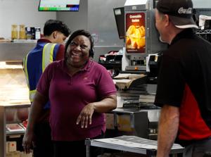 McDonald’s store manager and foster parent Donna Neal talks with employees Tuesday April, 14, 2026, in Hendersonville, Tenn. Neal has provided jobs for many of the teens she has fostered.