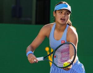 Emma Raducanu gets set to serve to Amanda Anisimova during their third-round match at the BNP Paribas Open in Indian Wells,