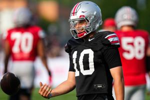 Ohio State Buckeyes quarterback Julian Sayin (10) smiles participates in the third day of training camp at the Woody Hayes