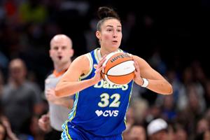 Dallas Wings forward Jessica Shepard (32) passes the ball during the first half against the Chicago Sky.
