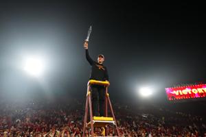 Southern California Trojans head coach Lincoln Riley leads the Spirit of Troy marching band in a rendition of Tribute to Troy after teh game against the UCLA Bruins at United Airlines Field at Los Angeles Memorial Coliseum.