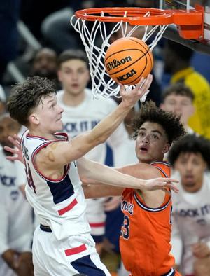 UConn Huskies guard Braylon Mullins (24) lays the ball in the basket Saturday, April 4, 2026, during a Final Four game against the Illinois Fighting Illini at Lucas Oil Stadium in Indianapolis.