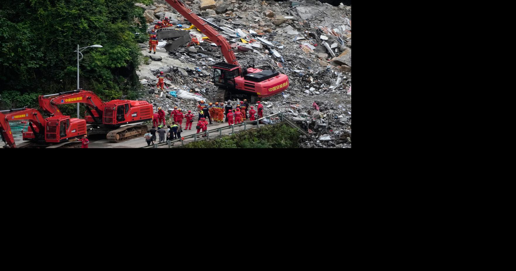 Rescuers race to find survivors in rain after a landslide in China kills at least 8