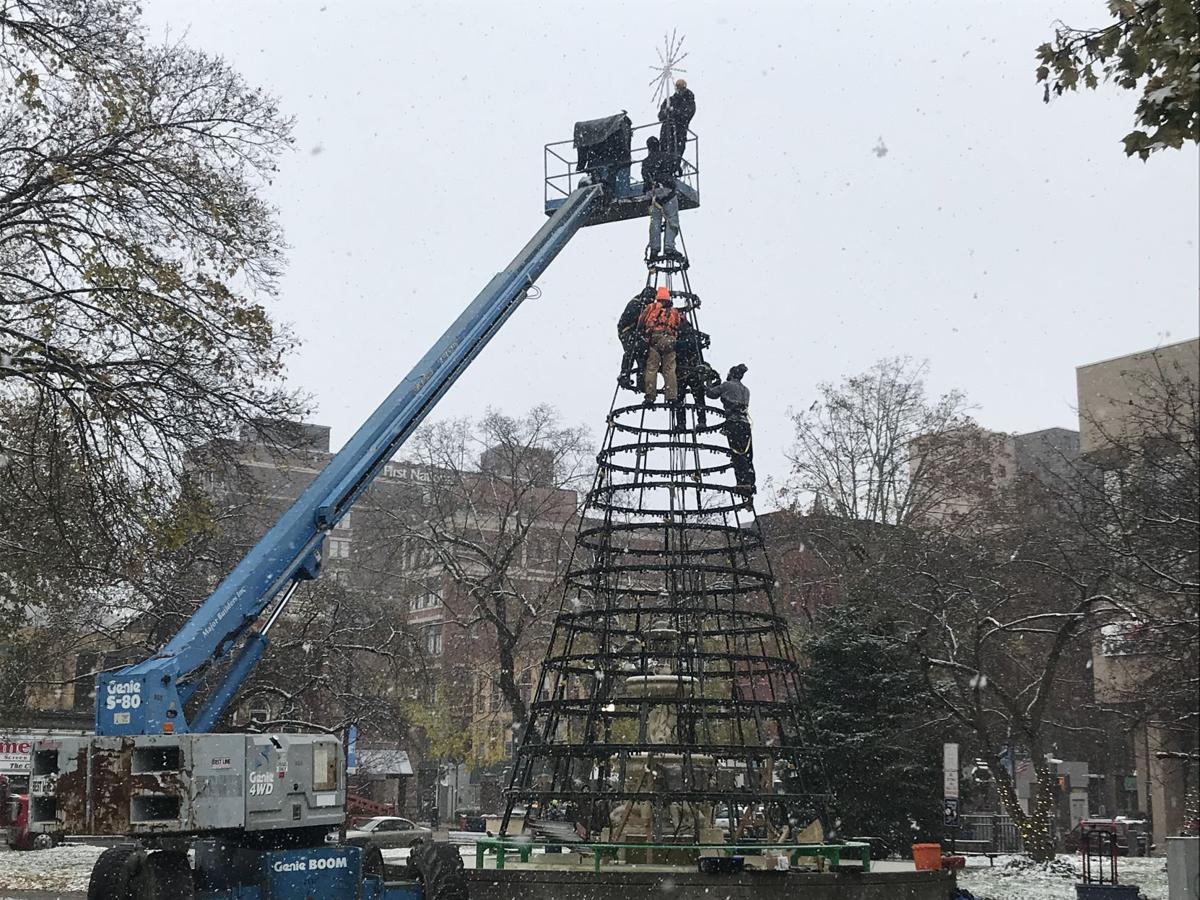 PHOTO GALLERY Workers and volunteers install the Christmas Tree