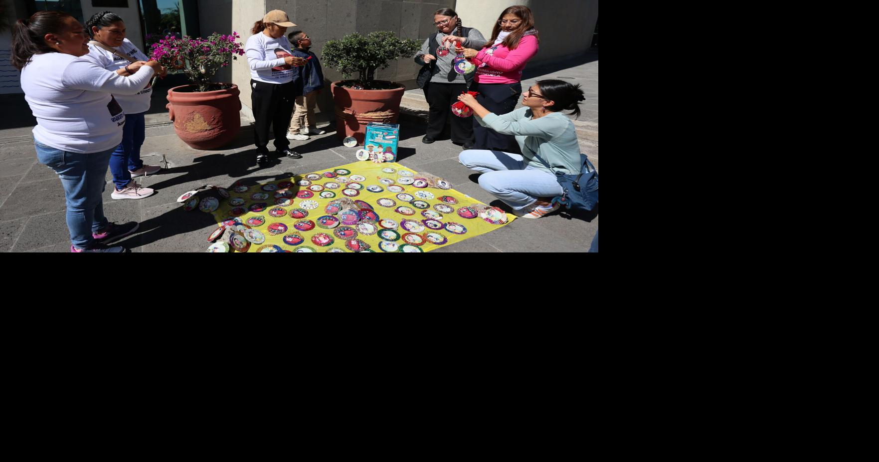 Christmas tree in Mexico carries faces of loved ones who never came home
