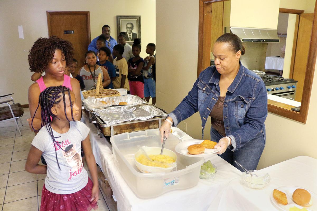 Church's feeding and after school programs serve up life lessons News
