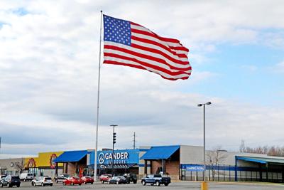 Company Massive Flag Will Be Lowered 35 Feet Due To Faa News Tribdem Com New planter and flag pole. company massive flag will be lowered