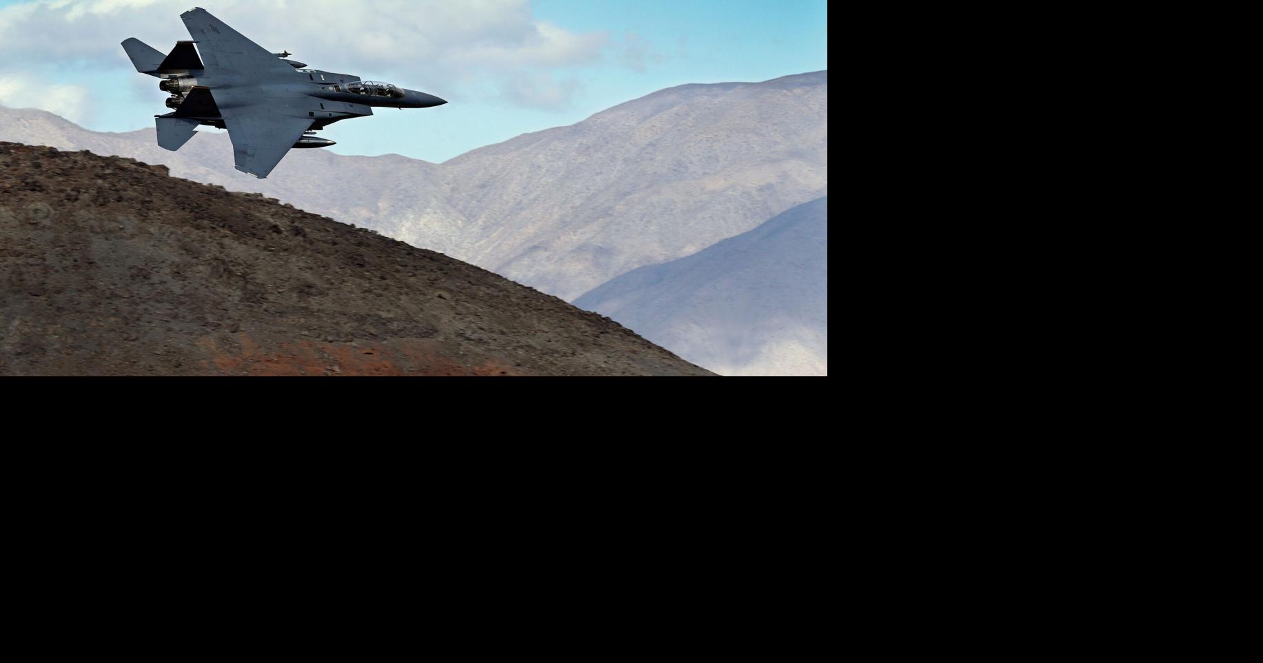 The Latest: U.S. and Iran race to find missing crew member from downed military plane