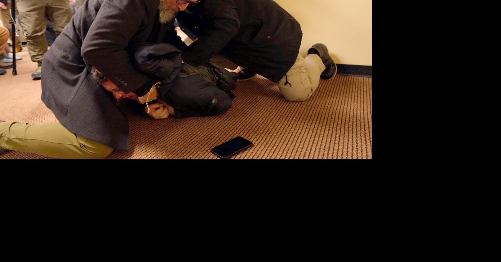 Man sprays unknown substance on U.S. Rep. Ilhan Omar and is tackled at Minneapolis town hall