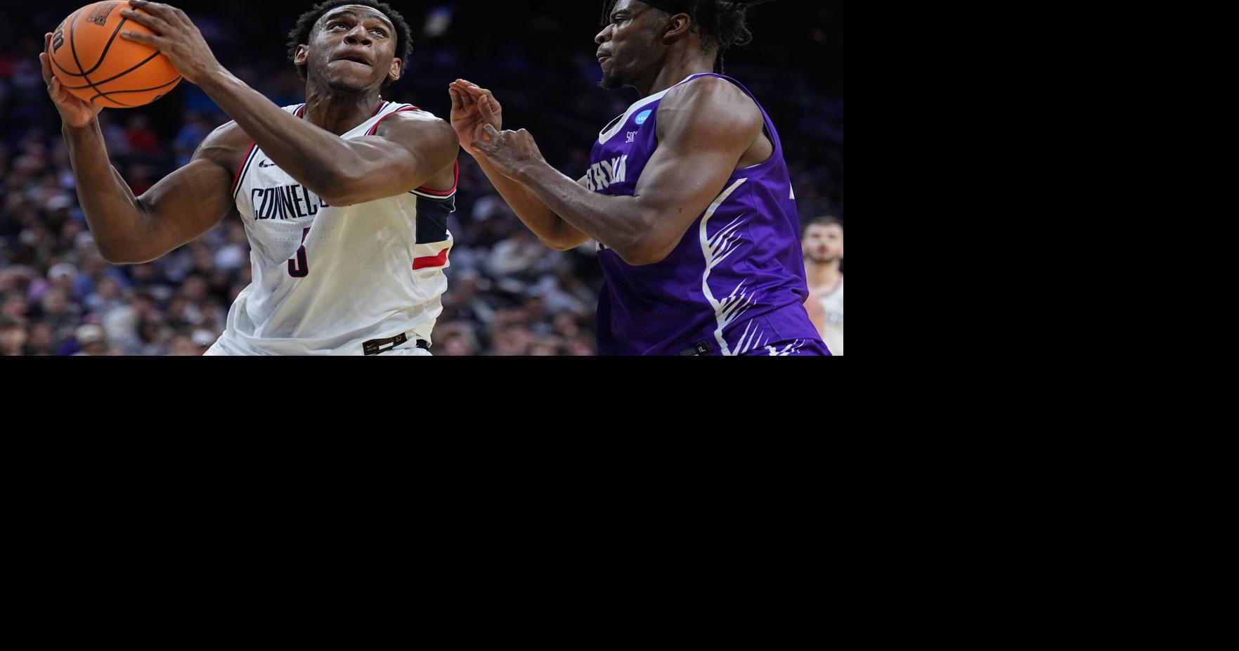 Tarris Reed Jr. has 31 points and 27 rebounds as No. 2 Connecticut beats Furman 82-71 in NCAA Tournament