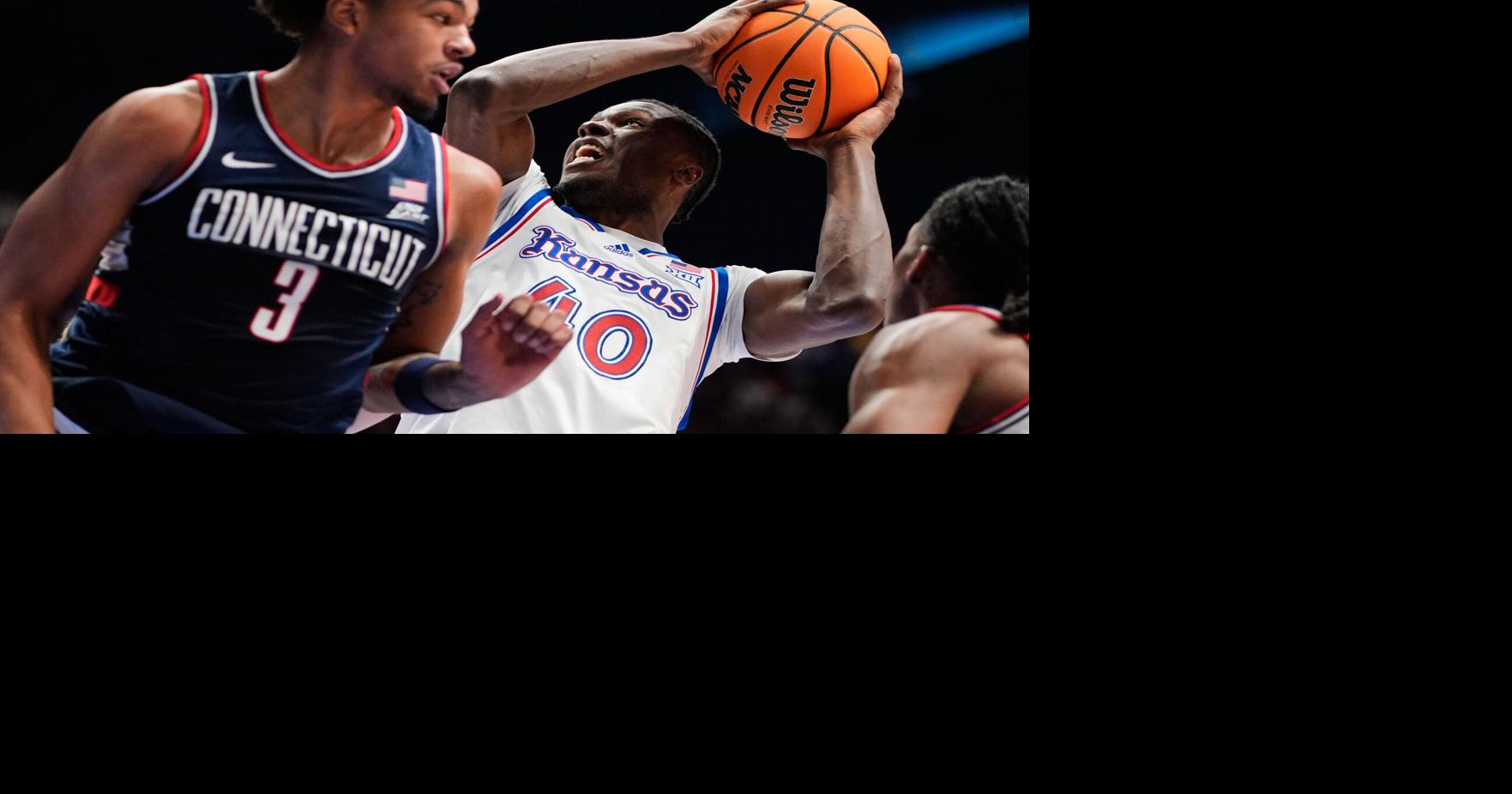 Freshman guard Braylon Mullins scores 17 points as No. 5 Connecticut rallies past No. 21 Kansas 61-56