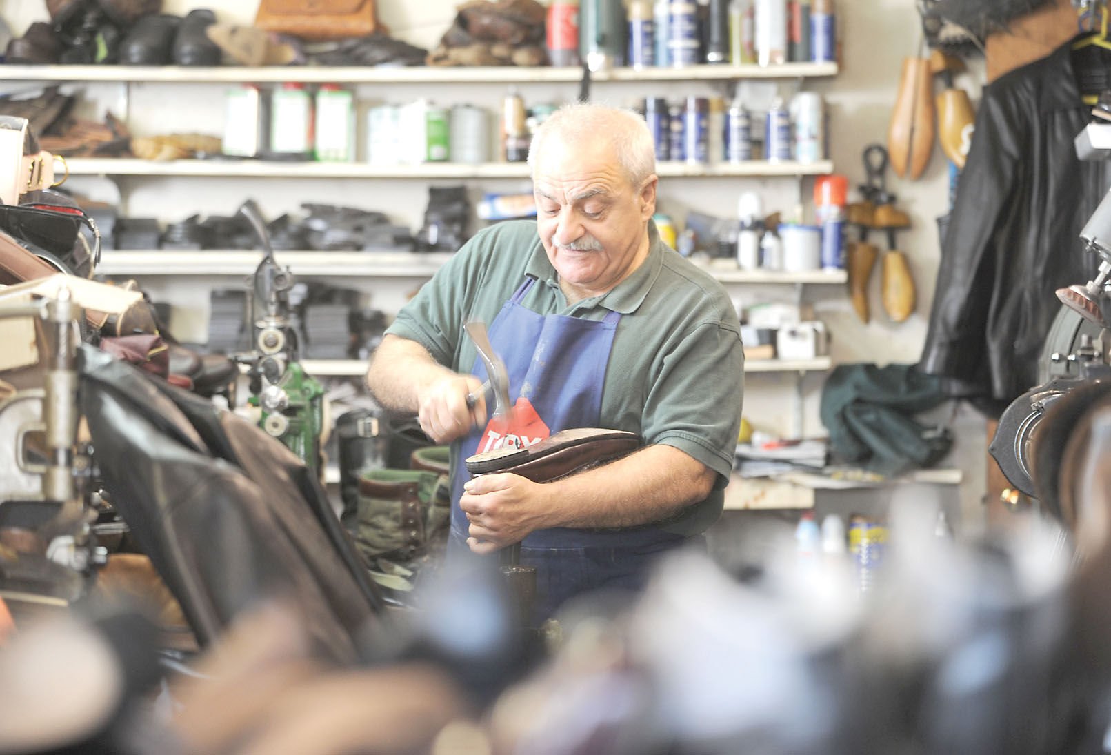 Shoe repairman helps customers' soles 