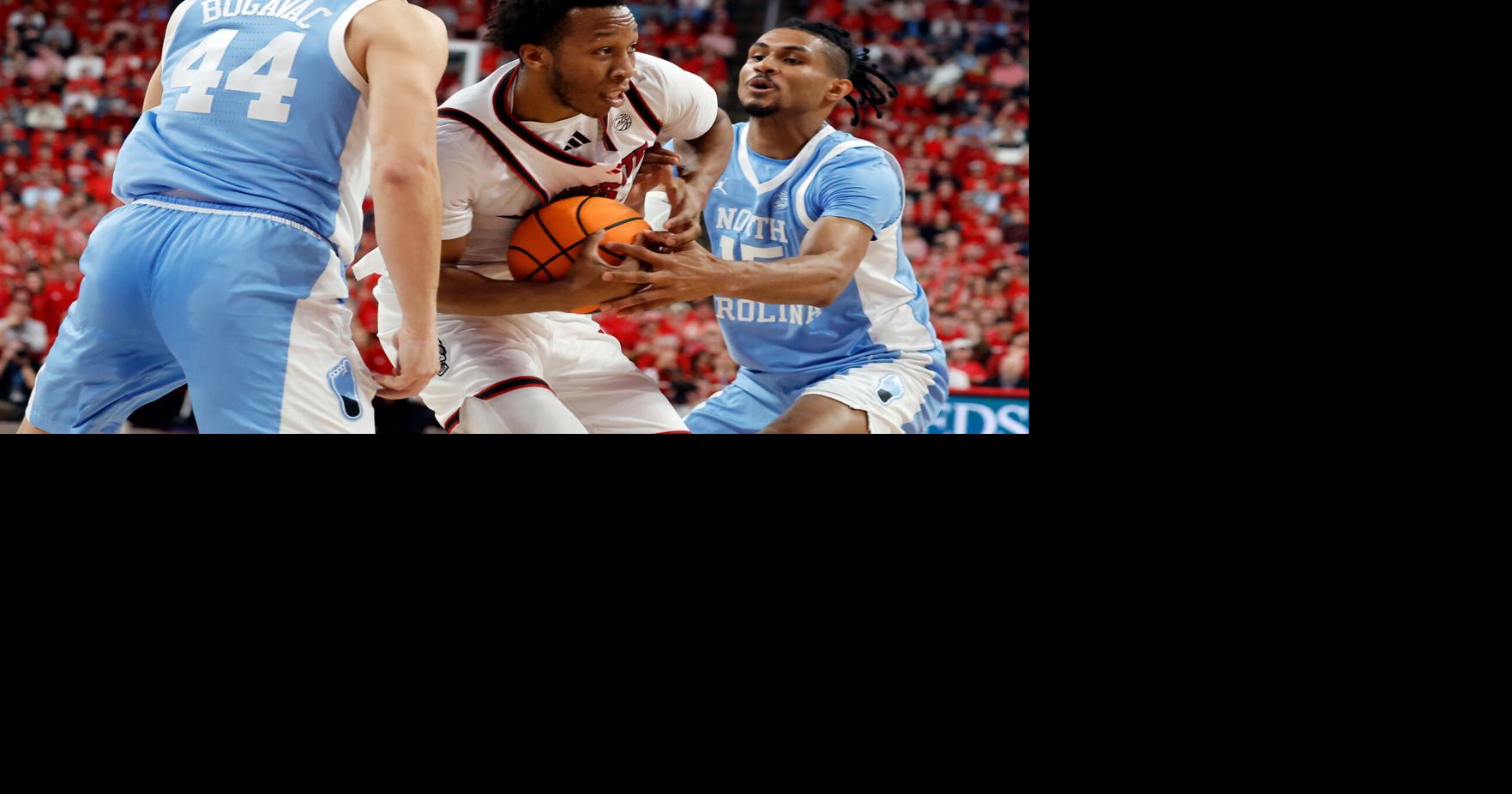 North Carolina State rolls past 16th-ranked and injury-depleted rival North Carolina 82-58