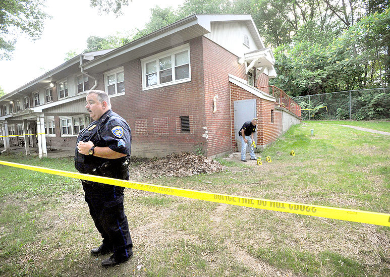 Police seize drugs, stolen gun in raid at Oakhurst Homes apartment