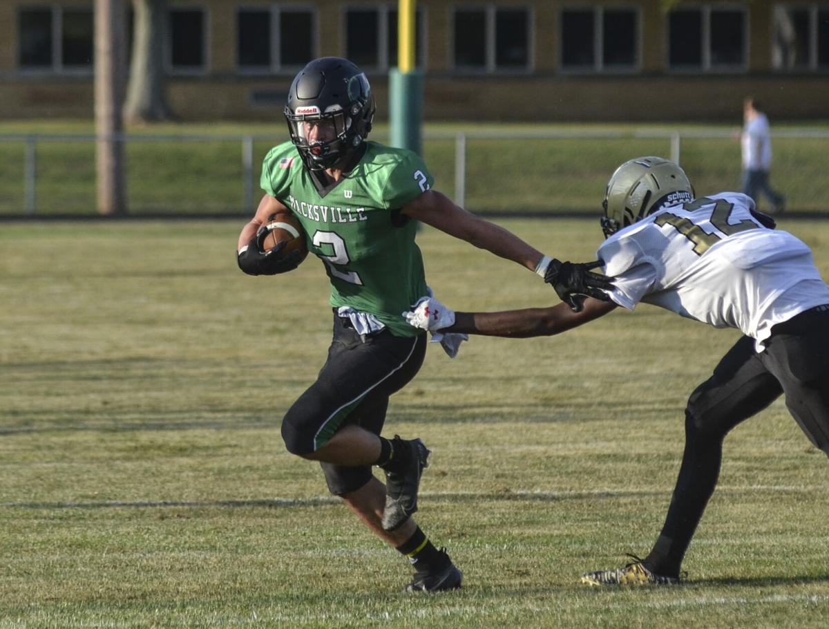 SPT 082120 Zander Wilbur stiff arm.jpg