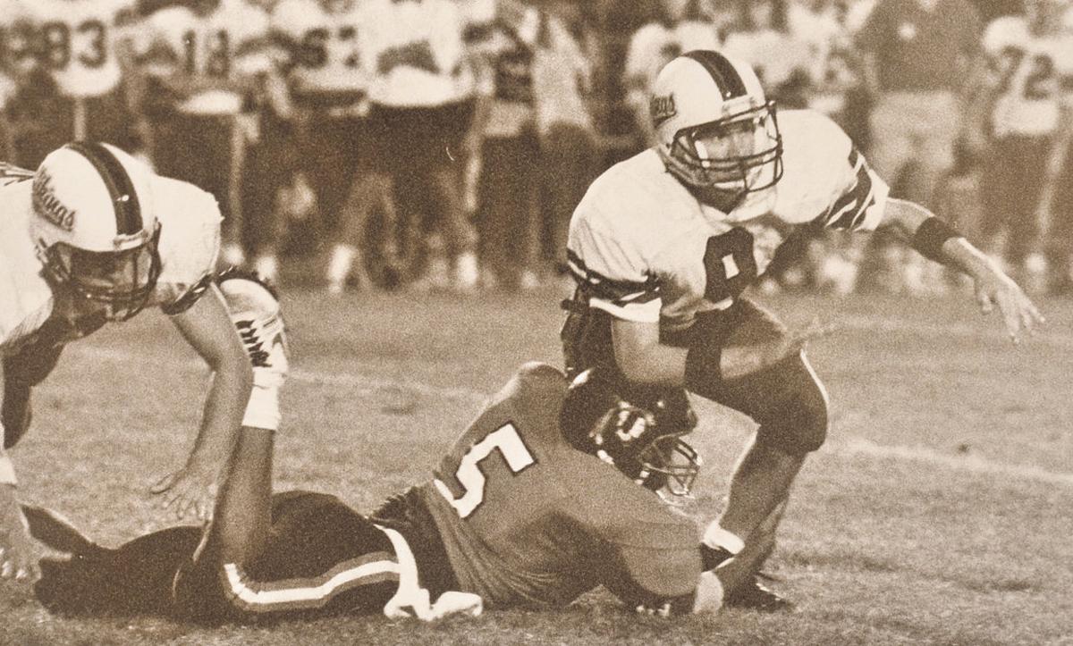 TH South FB star Tony McGee with a sack, 1988