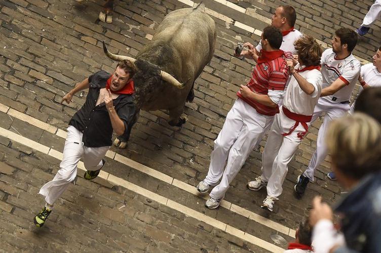 Spain: Three people gored in first Pamplona bull run