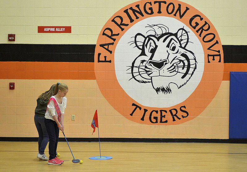 Fore! 'First Tee' program introduces school children to golf Local