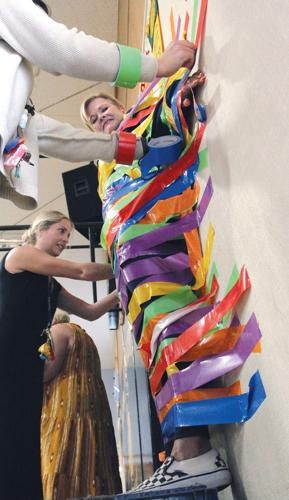 Turrill students tape principal, teachers to wall in fundraiser