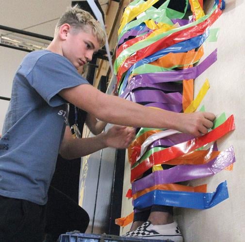 New Jersey students pay $1 to tape their teacher to a wall
