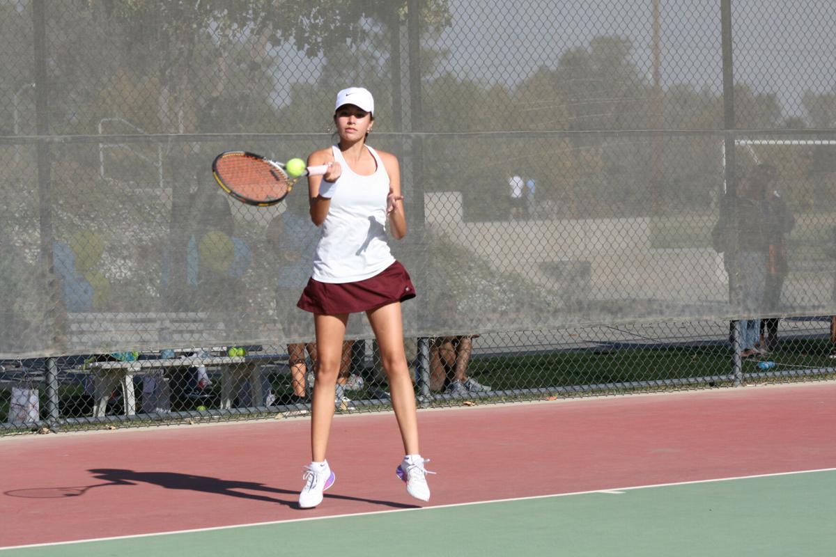 Girls’ tennis undefeated; clinch league title