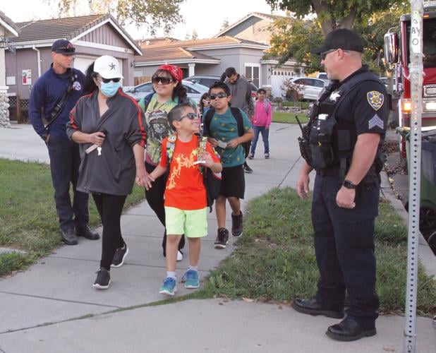 Students hit the pavement for Walk to School Day at Hawkins Elementary