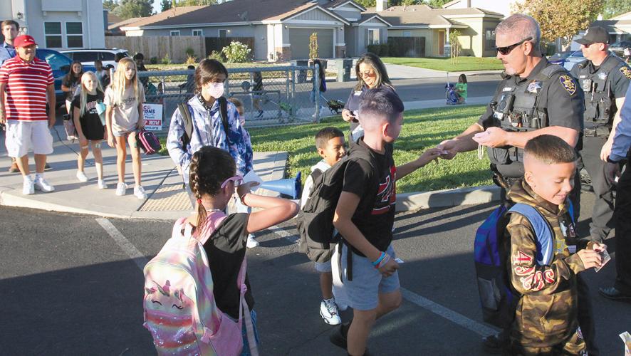 Students hit the pavement for Walk to School Day at Hawkins Elementary
