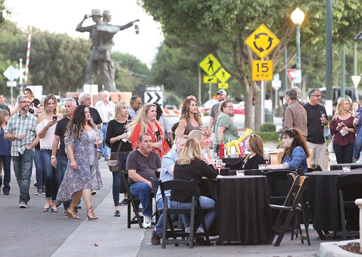 Crowd savors wine stroll Tracy Press Our Town