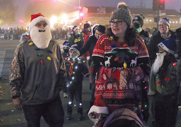 Thousands fill downtown for holiday light parade, tree lighting