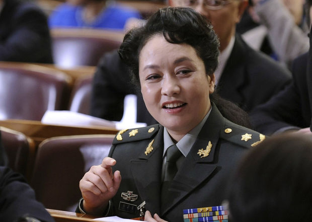 China boasts party chief's human side using wife's image    