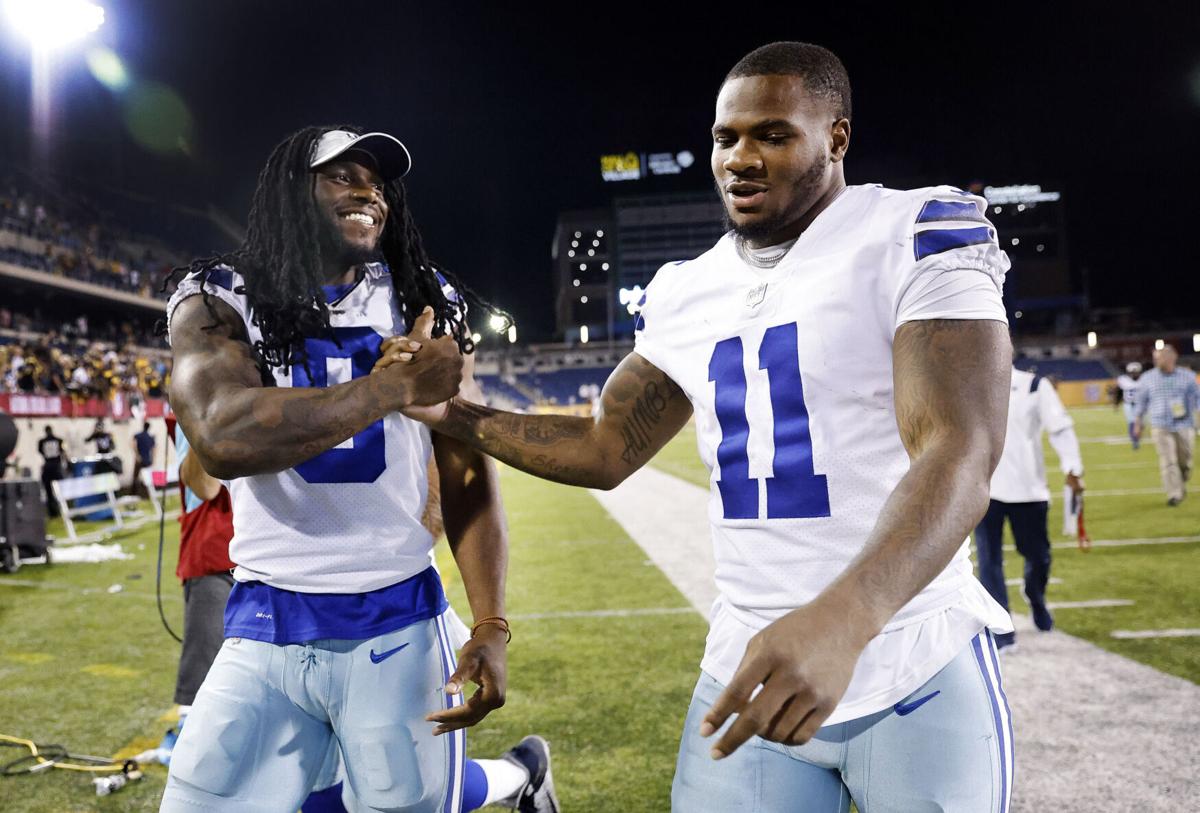 Dallas Cowboys linebacker Jaylon Smith congratulates rookie linebacker Micah Parsons after his first game on Thursday, August 5, 2021.