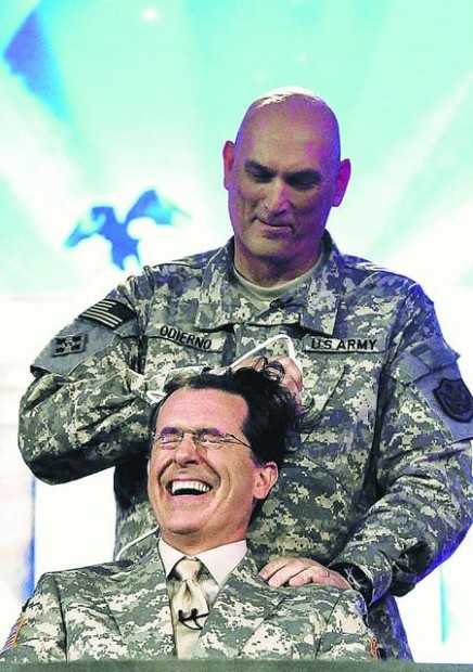 Colbert gets buzz cut on his first Iraq show  