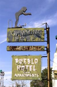 Old sign comes down for fix-up    