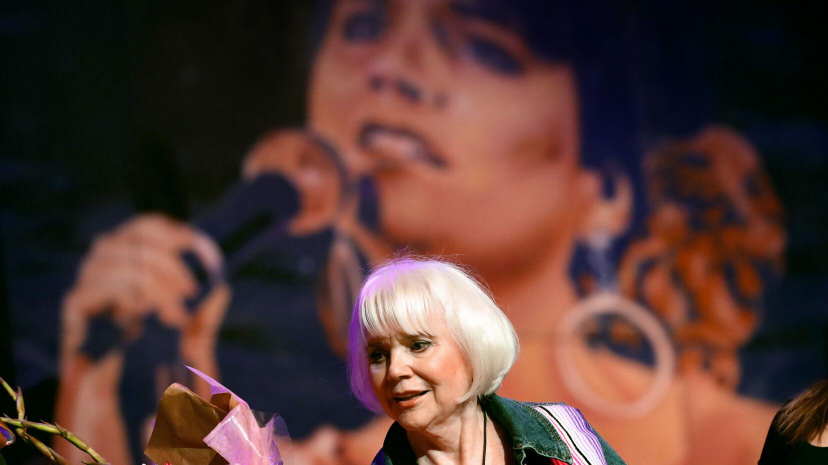 This artist was inspired by Linda Ronstadt. Now his mural will hang at the newly renamed music hall