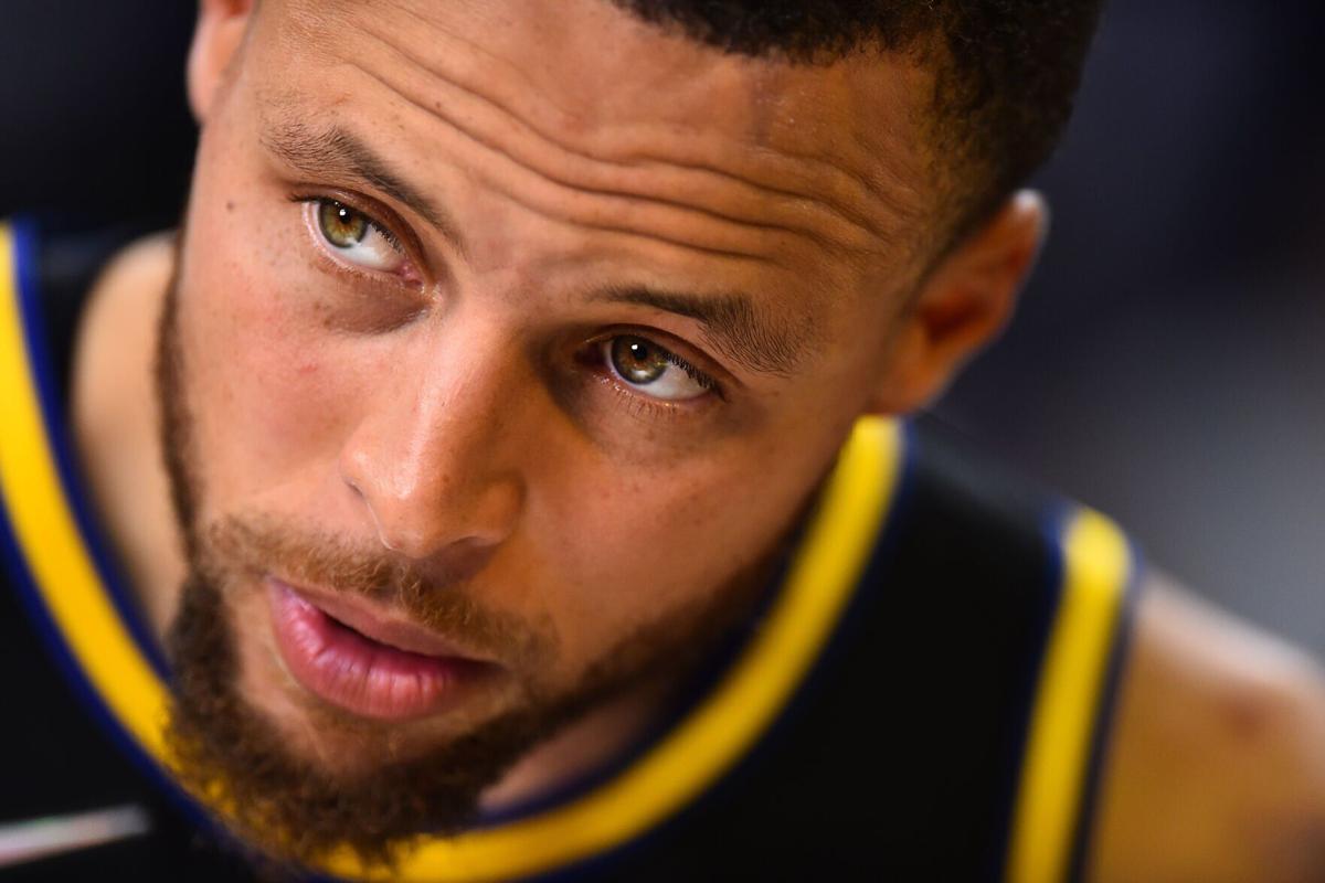 Golden State Warriors' Stephen Curry stands on the court during an interview after Game Three of a second-round NBA basketball playoff series at Chase Center in San Francisco, on Saturday, May 7, 2022.