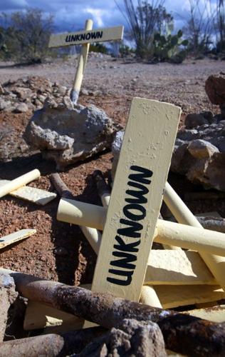 Wood 'headstones' replace inauthentic metal markers    