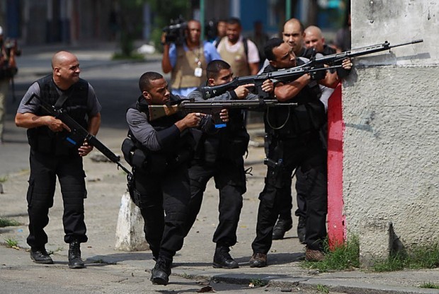 Elite police enter fortified Rio slum to battle gang  