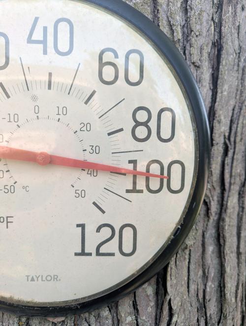 The heat approaches 100 degrees Fahrenheit on a residential thermometer in Farmingdale, New Jersey, on July 1, 2026.