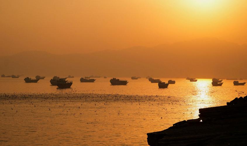 FILE PHOTO: Vessels at the Strait of Hormuz, as seen from Musandam
