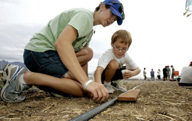 Finding where food comes from: Kids, parents plant, harvest with Big Green Bus, UA farm    
