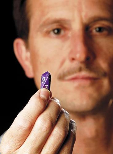 Fancy-dice maker sees patent case roll his way  