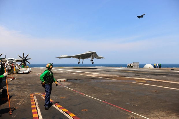 Experimental drone lands on aircraft carrier