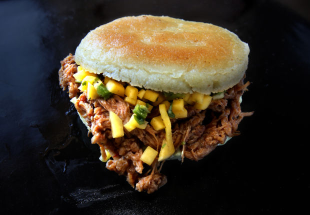 Making arepas, Colombian and Venezuelan bread